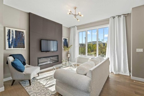 332 Lawthorn Way Se, Airdrie, AB - Indoor Photo Showing Living Room With Fireplace