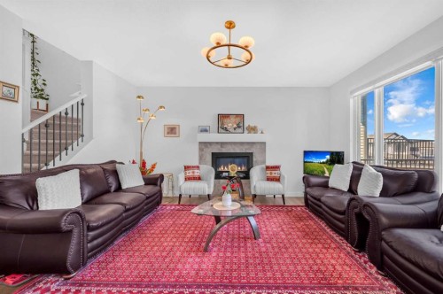 127 Ambleside Crescent Nw, Calgary, AB - Indoor Photo Showing Living Room With Fireplace