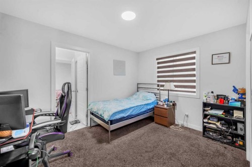 127 Ambleside Crescent Nw, Calgary, AB - Indoor Photo Showing Bedroom
