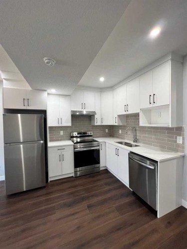 127 Ambleside Crescent Nw, Calgary, AB - Indoor Photo Showing Kitchen With Stainless Steel Kitchen With Double Sink