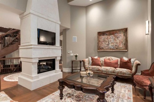 4 Aspen Ridge Bay Sw, Calgary, AB - Indoor Photo Showing Living Room With Fireplace