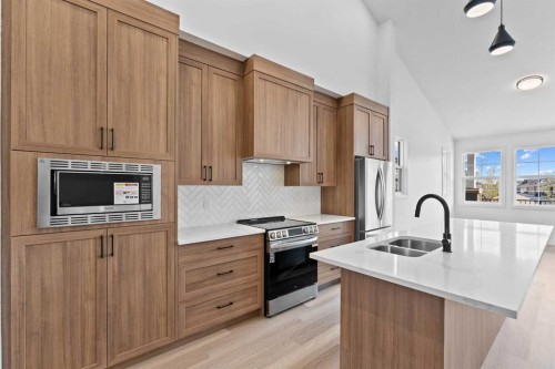 1800-15 Coopersfield Link Sw, Airdrie, AB - Indoor Photo Showing Kitchen With Double Sink With Upgraded Kitchen