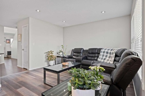 180 Panatella Way Nw, Calgary, AB - Indoor Photo Showing Living Room