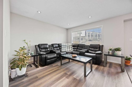 180 Panatella Way Nw, Calgary, AB - Indoor Photo Showing Living Room