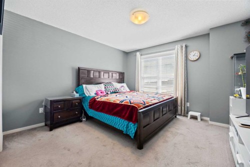 180 Panatella Way Nw, Calgary, AB - Indoor Photo Showing Bedroom