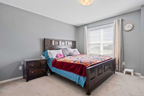 180 Panatella Way Nw, Calgary, AB - Indoor Photo Showing Bedroom