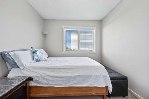 180 Panatella Way Nw, Calgary, AB - Indoor Photo Showing Bedroom