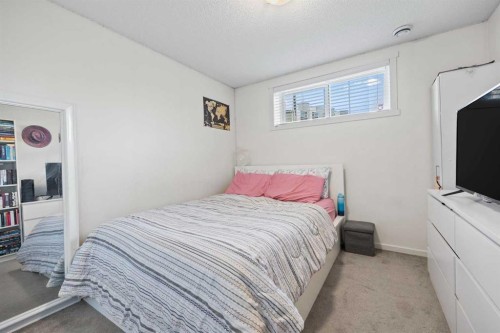 180 Panatella Way Nw, Calgary, AB - Indoor Photo Showing Bedroom