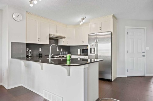 180 Panatella Way Nw, Calgary, AB - Indoor Photo Showing Kitchen With Stainless Steel Kitchen With Upgraded Kitchen