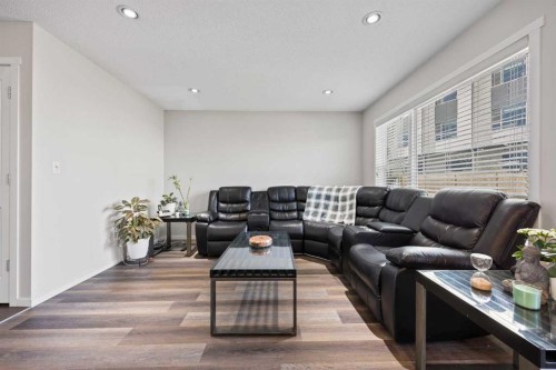 180 Panatella Way Nw, Calgary, AB - Indoor Photo Showing Living Room