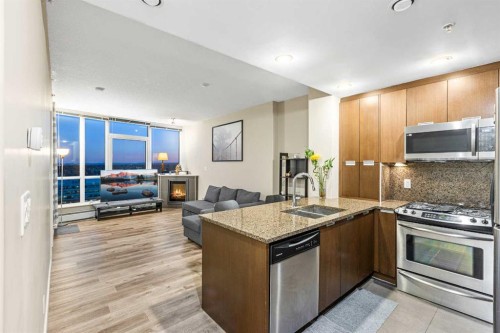 1403-99 Spruce Place Sw, Calgary, AB - Indoor Photo Showing Kitchen With Stainless Steel Kitchen With Double Sink With Upgraded Kitchen