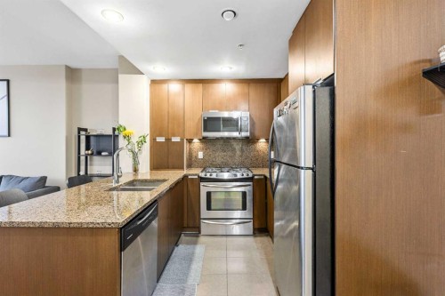 1403-99 Spruce Place Sw, Calgary, AB - Indoor Photo Showing Kitchen With Stainless Steel Kitchen With Double Sink With Upgraded Kitchen