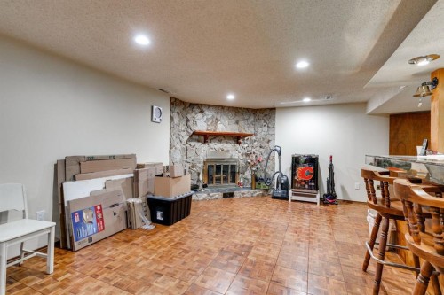 360 Malvern Close Ne, Calgary, AB - Indoor With Fireplace