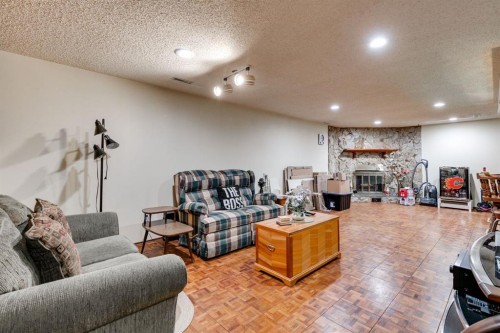 360 Malvern Close Ne, Calgary, AB - Indoor With Fireplace