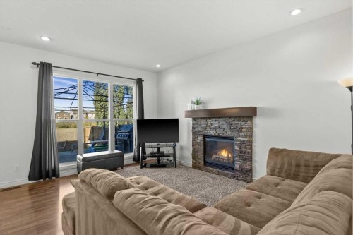 195 Hillcrest Circle Sw, Airdrie, AB - Indoor Photo Showing Living Room With Fireplace