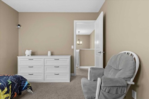195 Hillcrest Circle Sw, Airdrie, AB - Indoor Photo Showing Bedroom