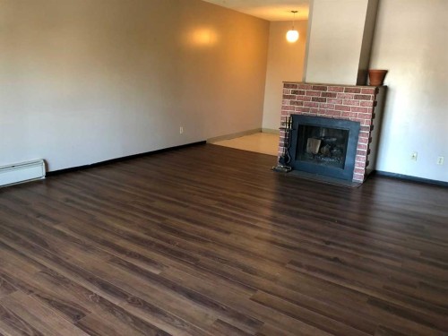 2410 14 Street Sw, Calgary, AB - Indoor Photo Showing Living Room With Fireplace
