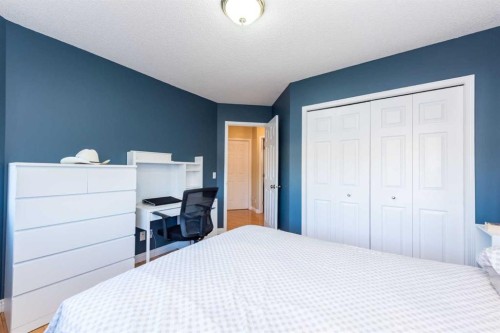 49 Rocky Ridge Heath Nw, Calgary, AB - Indoor Photo Showing Bedroom