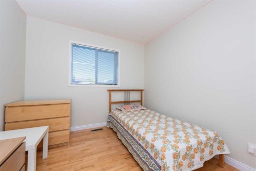 49 Rocky Ridge Heath Nw, Calgary, AB - Indoor Photo Showing Bedroom