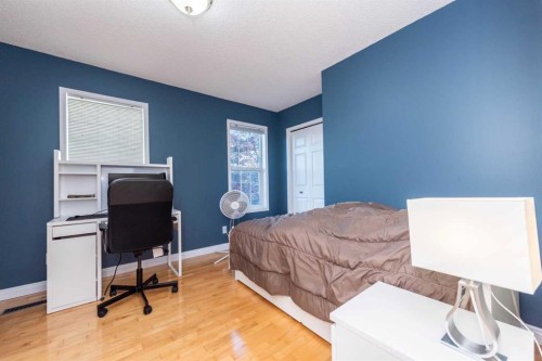49 Rocky Ridge Heath Nw, Calgary, AB - Indoor Photo Showing Bedroom