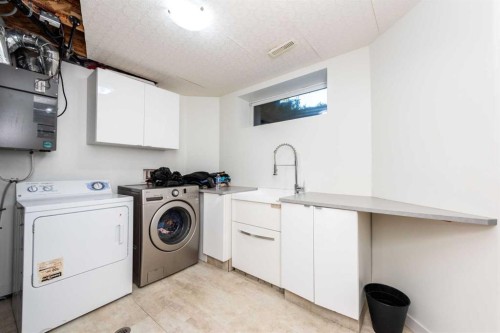 49 Rocky Ridge Heath Nw, Calgary, AB - Indoor Photo Showing Laundry Room