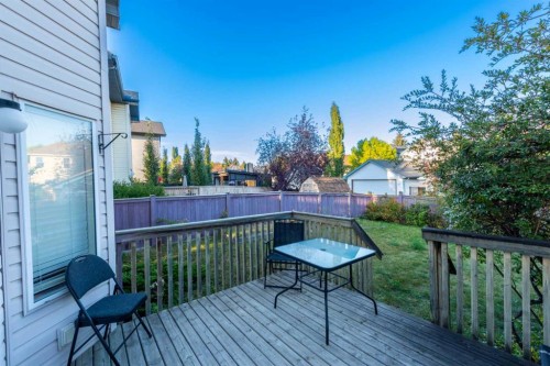 49 Rocky Ridge Heath Nw, Calgary, AB - Outdoor With Deck Patio Veranda