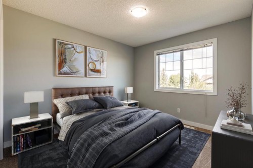 605 Morningside Park Sw, Airdrie, AB - Indoor Photo Showing Bedroom