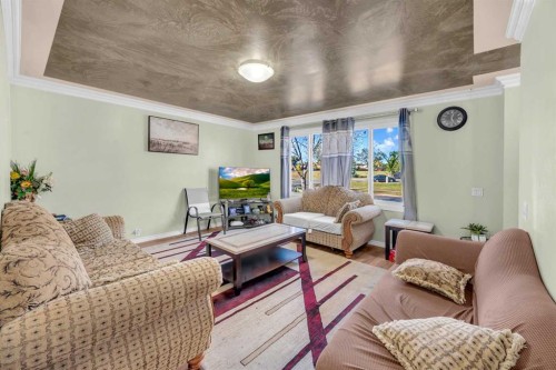 1019 Falworth Road Ne, Calgary, AB - Indoor Photo Showing Living Room