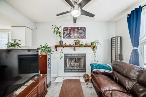 3315 Catalina Boulevard Ne, Calgary, AB - Indoor Photo Showing Living Room With Fireplace