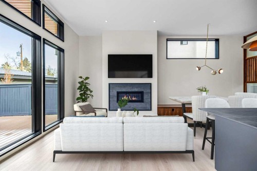 3D Willow Crescent Sw, Calgary, AB - Indoor Photo Showing Living Room With Fireplace