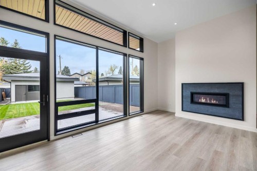 3D Willow Crescent Sw, Calgary, AB - Indoor Photo Showing Living Room With Fireplace