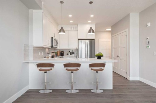 1114-110 Greenbriar Place Nw, Calgary, AB - Indoor Photo Showing Kitchen With Stainless Steel Kitchen With Upgraded Kitchen