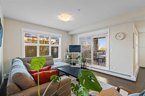 2206-11 Mahogany Row Se, Calgary, AB - Indoor Photo Showing Living Room