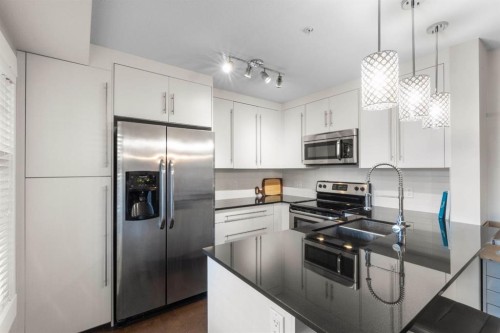 2206-11 Mahogany Row Se, Calgary, AB - Indoor Photo Showing Kitchen With Stainless Steel Kitchen With Upgraded Kitchen