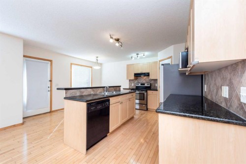 17 Royal Birkdale Crescent Nw, Calgary, AB - Indoor Photo Showing Kitchen With Double Sink