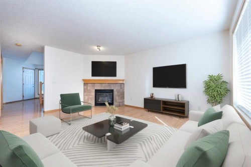 17 Royal Birkdale Crescent Nw, Calgary, AB - Indoor Photo Showing Living Room With Fireplace