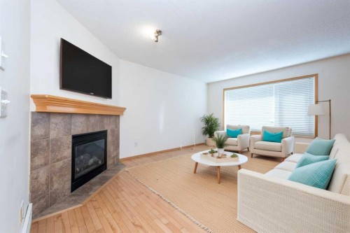 17 Royal Birkdale Crescent Nw, Calgary, AB - Indoor Photo Showing Living Room With Fireplace