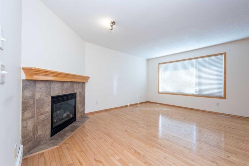 17 Royal Birkdale Crescent Nw, Calgary, AB - Indoor With Fireplace