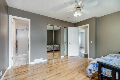 16 Ridgegate Way Sw, Airdrie, AB - Indoor Photo Showing Bedroom