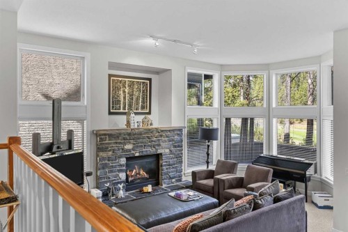 153-13 Aspen Glen, Canmore, AB - Indoor Photo Showing Living Room With Fireplace