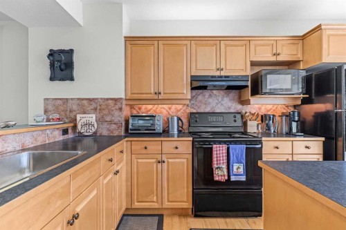 153-13 Aspen Glen, Canmore, AB - Indoor Photo Showing Kitchen With Double Sink