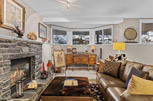 153-13 Aspen Glen, Canmore, AB - Indoor Photo Showing Living Room With Fireplace