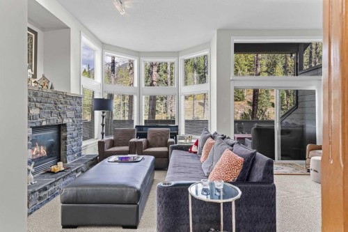 153-13 Aspen Glen, Canmore, AB - Indoor Photo Showing Living Room With Fireplace