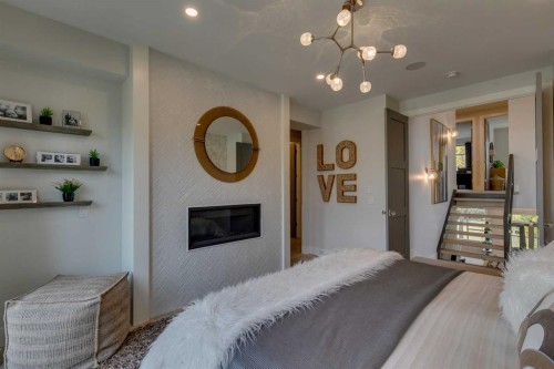 1827 22 Avenue Sw, Calgary, AB - Indoor Photo Showing Bedroom With Fireplace