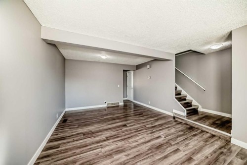 327 Falshire Way Ne, Calgary, AB - Indoor Photo Showing Other Room