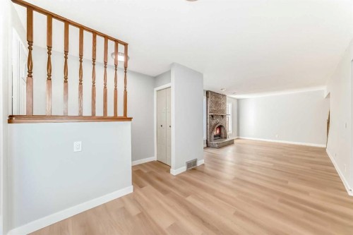 656 Woodbine Boulevard Sw, Calgary, AB - Indoor Photo Showing Other Room With Fireplace