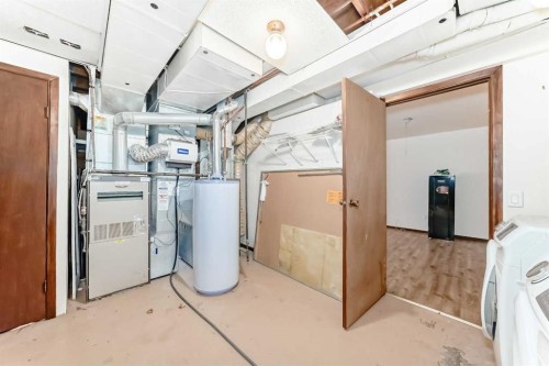 656 Woodbine Boulevard Sw, Calgary, AB - Indoor Photo Showing Laundry Room