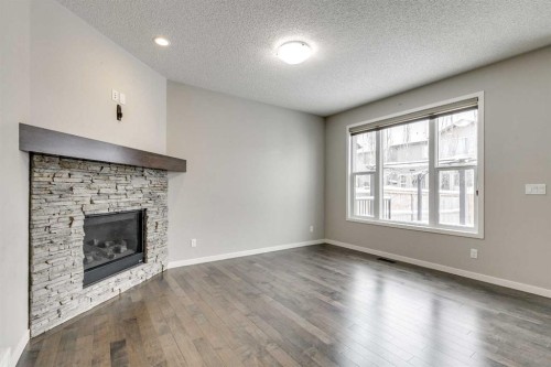 2107 Brightoncrest Green Se, Calgary, AB - Indoor Photo Showing Living Room With Fireplace