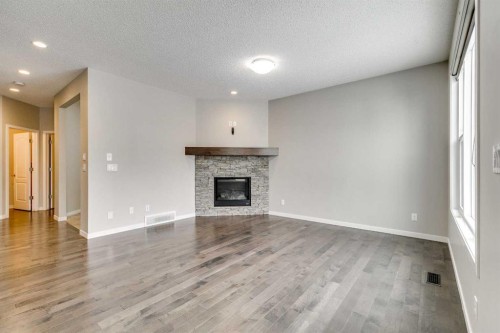 2107 Brightoncrest Green Se, Calgary, AB - Indoor Photo Showing Living Room With Fireplace