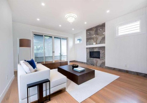 105 Hartford Road Nw, Calgary, AB - Indoor Photo Showing Living Room With Fireplace